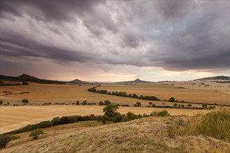 Bohemian low mountain range. Dramatic weather mood. Summer thunderstorms in the north of the Czech