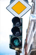 Traffic lights with cannabis leaf and right of way sign in Aachen, Germany, Europe