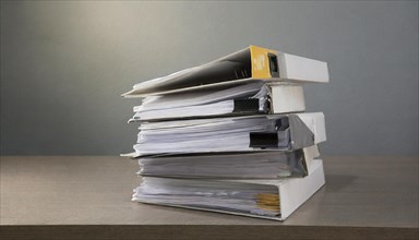 A pile of folders with lots of papers against a grey background, symbolism bureaucracy, AI