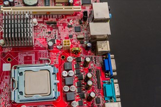 Closeup of computer mother board with installed cpu on black counter top