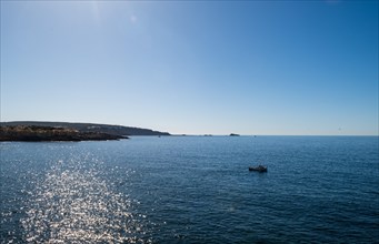 View of the sea with fishing boat from the Mirador de les Malgrats near Santa Ponca or Santa Ponsa,