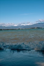 Splashing waves hitting the shore of Lake Garda, Sirmione, Lake Garda, Italy, Europe
