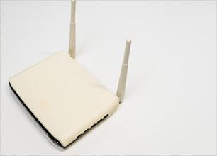 White wireless router with two antenna for home computer network