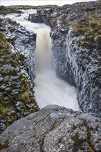 Rushing stream plunges into a narrow gorge, Fjallabak Nature Reserve, Sudurland, Iceland, Europe