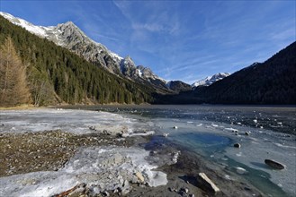 Ice rink in winter on an icy lake, Lake Antholz in the Antholz Valley, Val Pusteria, South Tyrol,