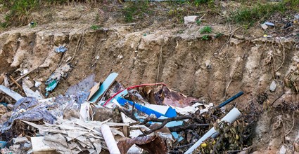 Debris from construction materials scattered at a site of soil erosion, in South Korea