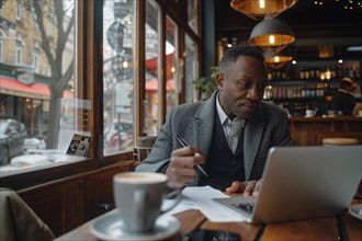 Man in a suit working on laptop in a coffee shop, looking pensive, AI generated