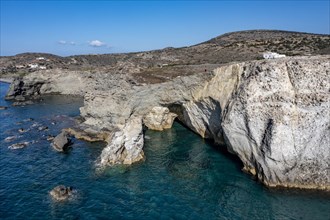 Cliff with rock arch near Sarakinikoer, Milos, Cyclades, Greece, Europe