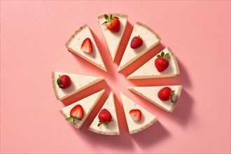 Top view of strawberry cheesecake on pink background. KI generiert, generiert, AI generated