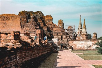 Ancient ruins in Ayutthaya Historical Park, a famous tourist attraction in old city of Ayutthaya,