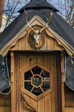 Wooden door with deer antlers, Allgaeu, Swabia, Bavaria, Germany, Europe