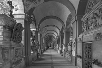Arcade with tombs at the Monumental Cemetery, Cimitero monumentale di Staglieno), Genoa, Italy,
