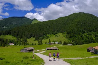 Hikers in front of the Albert Link Huette, Spitzingsee area, Bavarian Hausberge, Alps, Upper