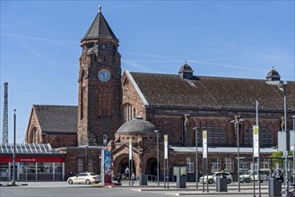 Historic Wilhelmine railway station, clock tower, reception building with bus station,