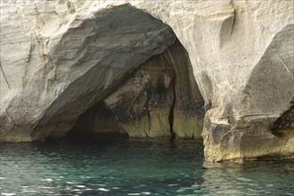 Caves in the white rock on the coast near Sarakinikoer, Milos, Cyclades, Greece, Europe