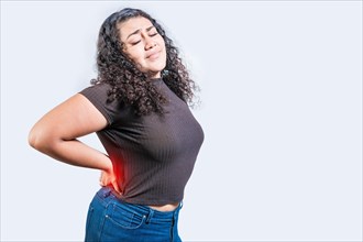 Woman with back pain on isolated background. lumbar problems concept. Girl with spine problems