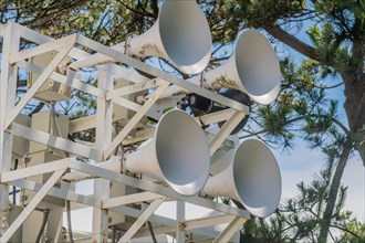 An array of white megaphones mounted on a support structure, in Ulsan, South Korea, Asia