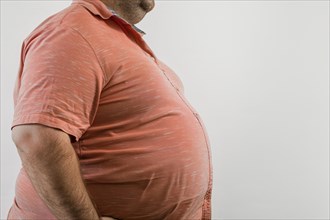 Close up of fat belly of heavily obese man in shirt on white background. KI generiert, generiert,
