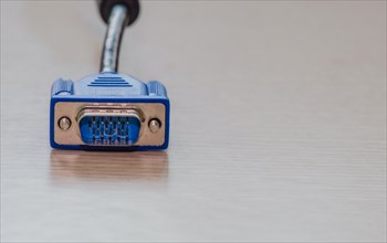 A perspective view of a blue VGA connector for computer hardware, in South Korea