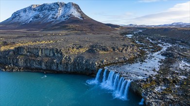 Pjofafoss waterfall, Burfell mountain in the background, drone shot, Sudurland, Iceland, Europe
