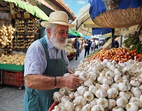 Elderly man with straw hat selling garlic at a lively street market, AI generated, AI generated