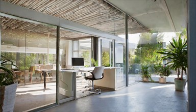 Modern office with glass fronts and plants offers a bright and natural working environment, Symbol