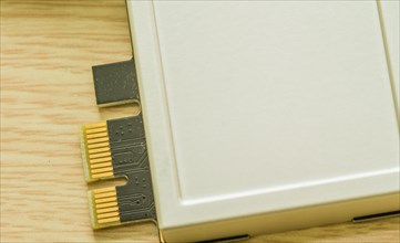 An array of USB flash drives with beige casing and gold connectors, in South Korea