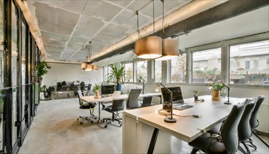Inviting office with natural lighting, illuminated by elegant pendant luminaires, symbol office, AI