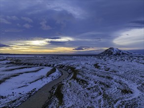 Overgrown river landscape, onset of winter, sunset, volcanic hills, Fjallabak Nature Reserve, drone