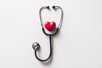 Stethoscope with red heart on white background. KI generiert, generiert, AI generated