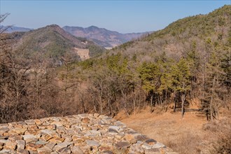 Landscape of mountain valley from atop stone fortress wall in Boeun, South Korea, Asia