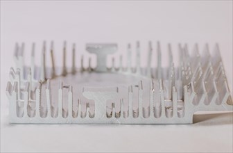 Closeup of fins of rectangle aluminum heat sink on white background