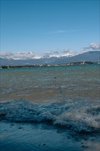 Splashing waves hitting the shore of Lake Garda, Sirmione, Lake Garda, Italy, Europe