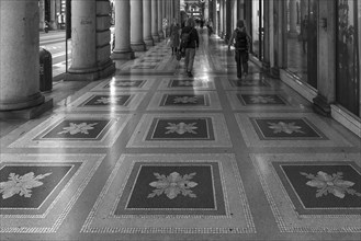 Mosaic floor in the historic arcades of the former Palazzo of the Italian General Navigation, built
