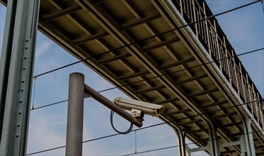 Security camera mounted on a metal pole under a metal bridge in Daejeon, South Korea, Asia