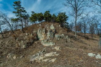 Large rock formations jutting from mountainside on winter morning in Boeun, South Korea, Asia