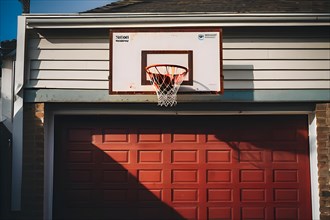 90s style basketball hoop suspended above a garage door, AI generated