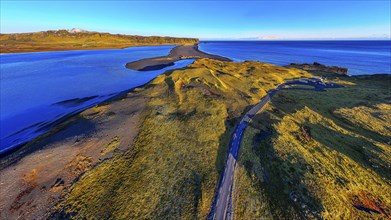 Dyrholaos lagoon in the evening light, drone shot, Sudurland, Iceland, Europe