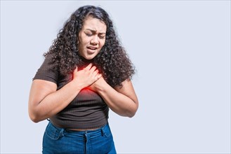 People with chest pain isolated. Young woman with tachycardia isolated. Latin girl with heart pain.