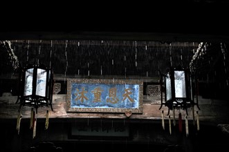 Old village interior, banner, lamp, china