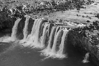 Pjofafoss waterfall, black and white photo, Sudurland, Is