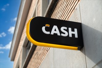 Sign showing logo of ATM cash dispenser of bank neutral Bancontact CASH point in Flanders, Belgium,