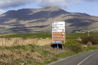 An Irish language road sign in the heart of the Kerry Gaeltacht or Irish-speaking area showing the