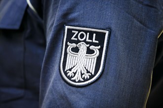 Customs logo on the shirt of a customs officer. Berlin, 03.04.2024