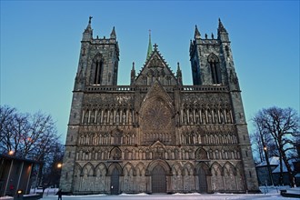 Front view of the historic cathedral on a winter evening, Nidaros Domkirke, Trondheim, Norway,