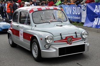 A white vintage racing car with red stripes and racing number at an event, SOLITUDE REVIVAL 2011,