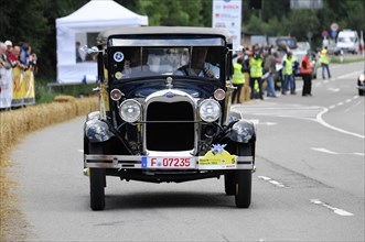 Ford Model A, year of construction 1929, A black Ford Cabriolet vintage car drives in a race with