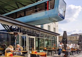 Suspension railway above the outdoor restaurant at the main railway station, Wuppertal, Bergisches