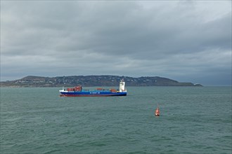 Container ship arrives at the harbour, Howth Peninsula, Dublin, Republic of Ireland