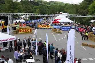 Overview of a motorsport event with spectators and advertising banners, SOLITUDE REVIVAL 2011,